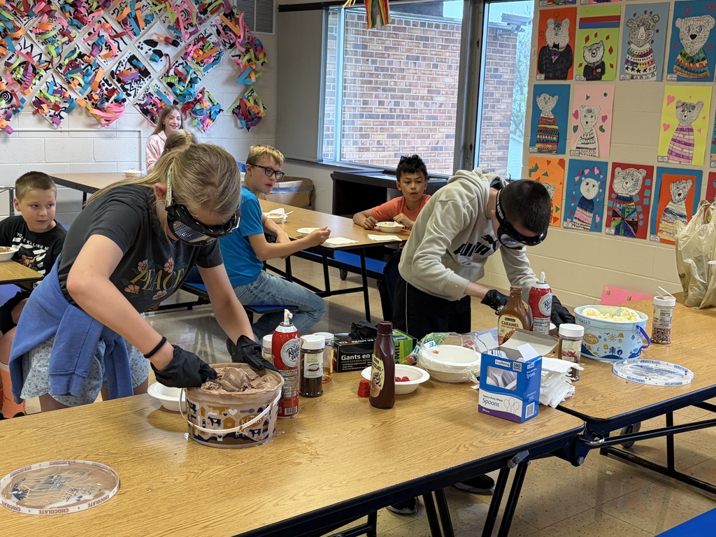 students make sundaes during a counteract activity with beer goggles on