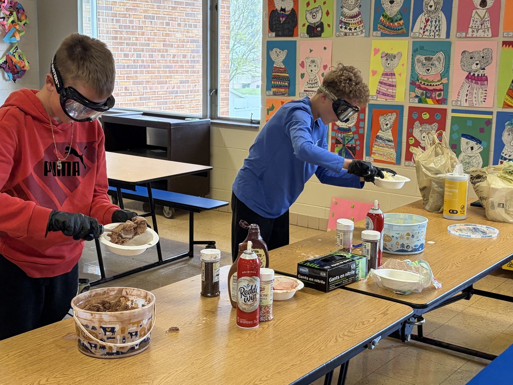 students make sundaes during a counteract activity with beer goggles on
