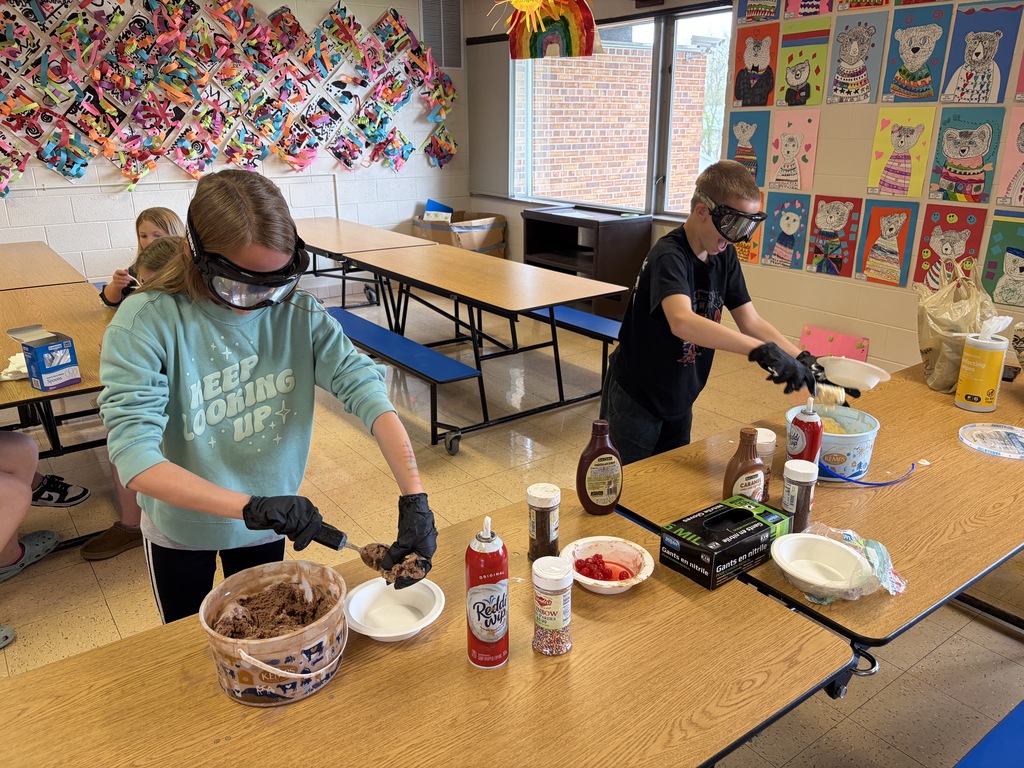 students make sundaes during a counteract activity with beer goggles on