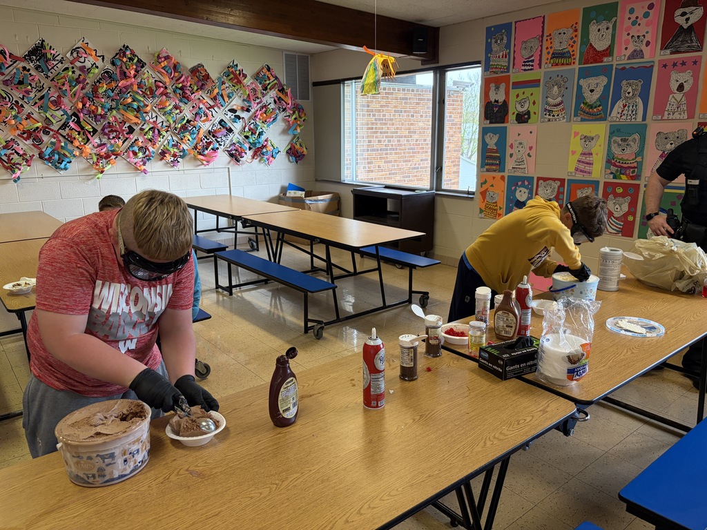 students make sundaes during a counteract activity with beer goggles on