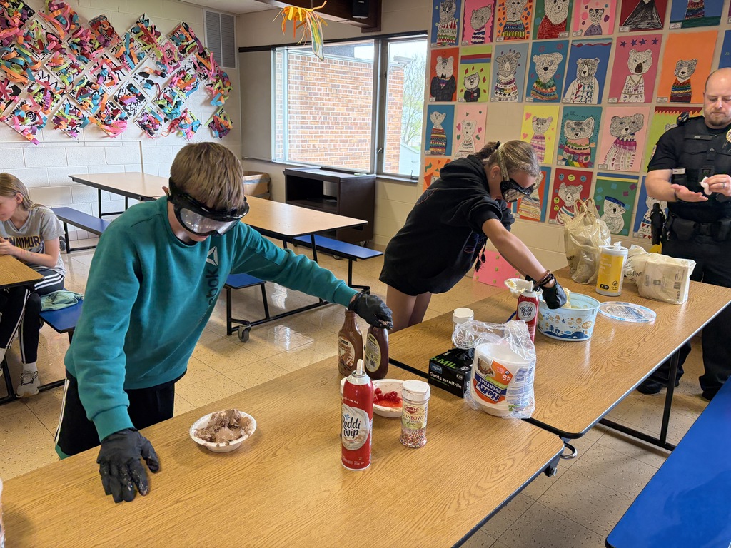 students make sundaes during a counteract activity with beer goggles on