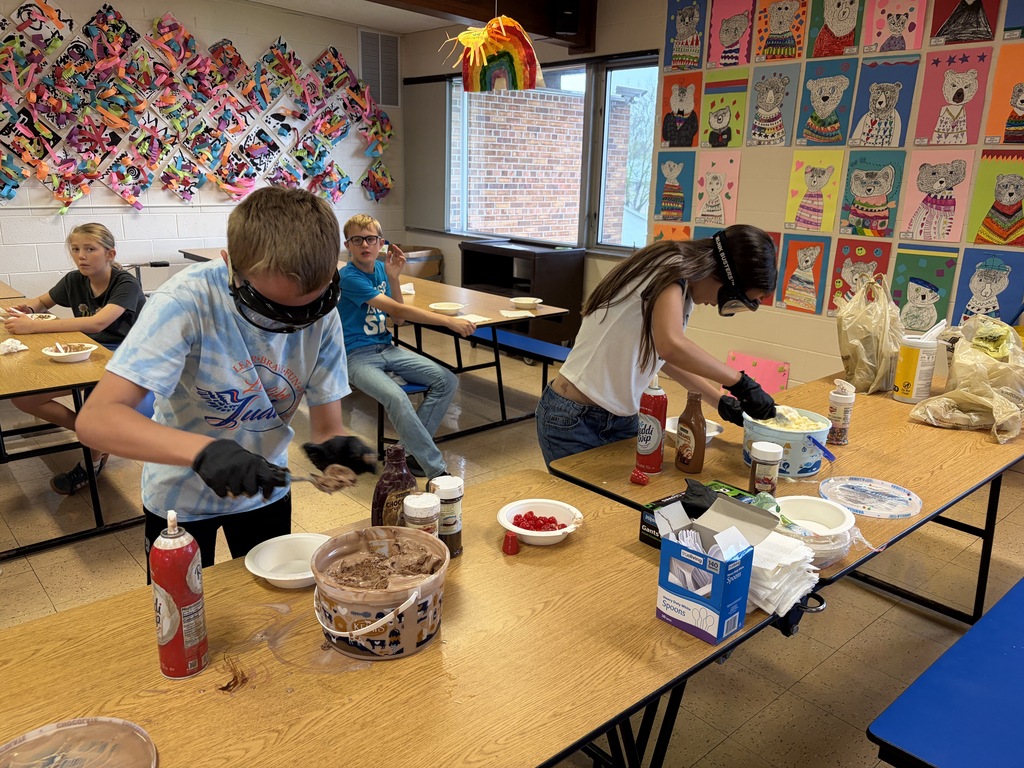 students make sundaes during a counteract activity with beer goggles on