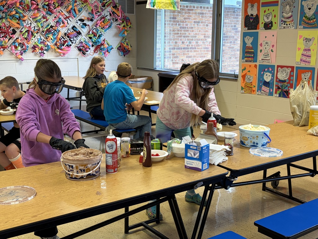 students make sundaes during a counteract activity with beer goggles on