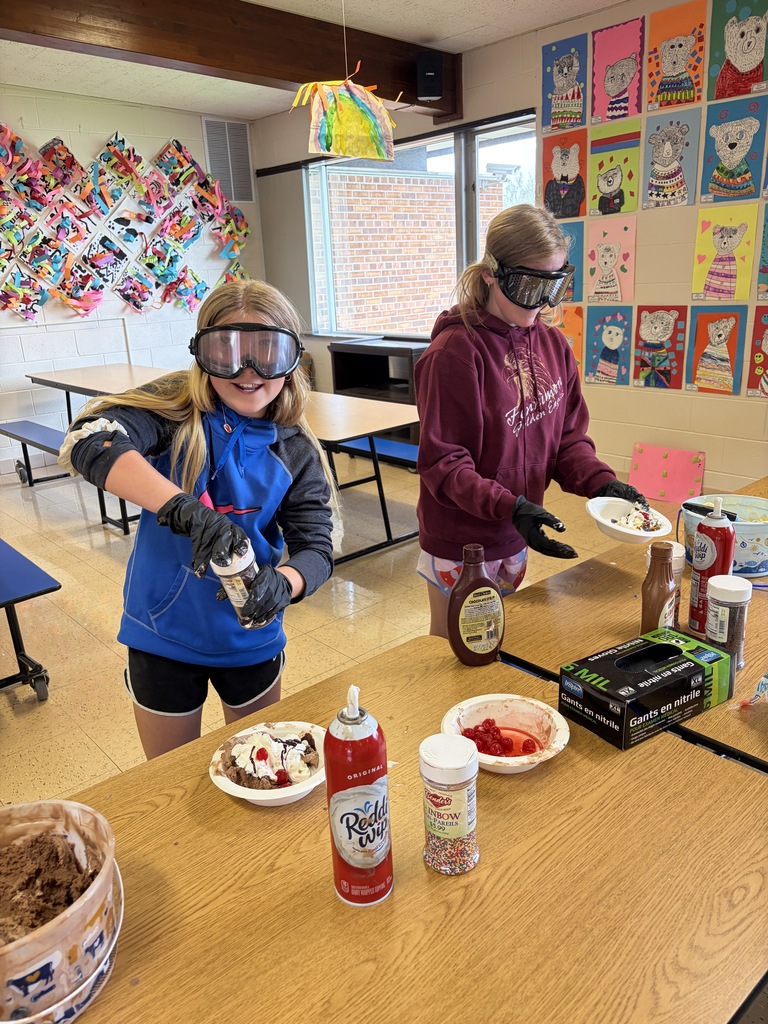 students make sundaes during a counteract activity with beer goggles on