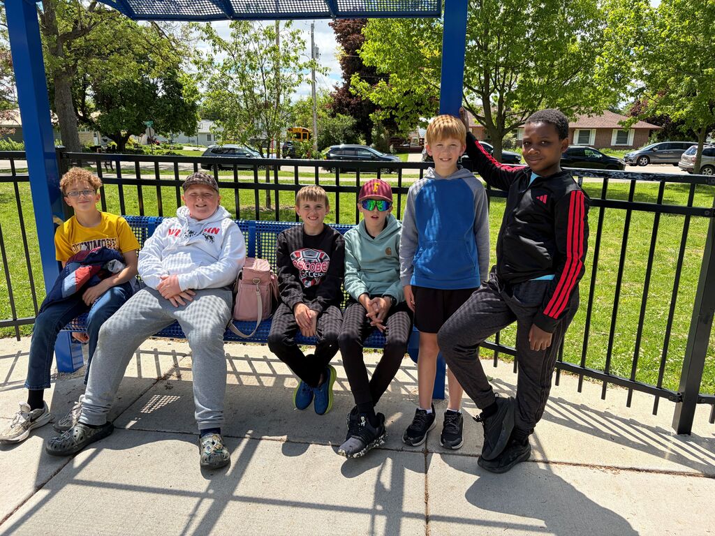 students take a break at the park