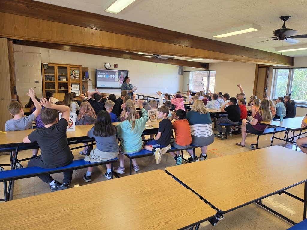 students listen to a speaker from Emplify Health talk about being safe at home