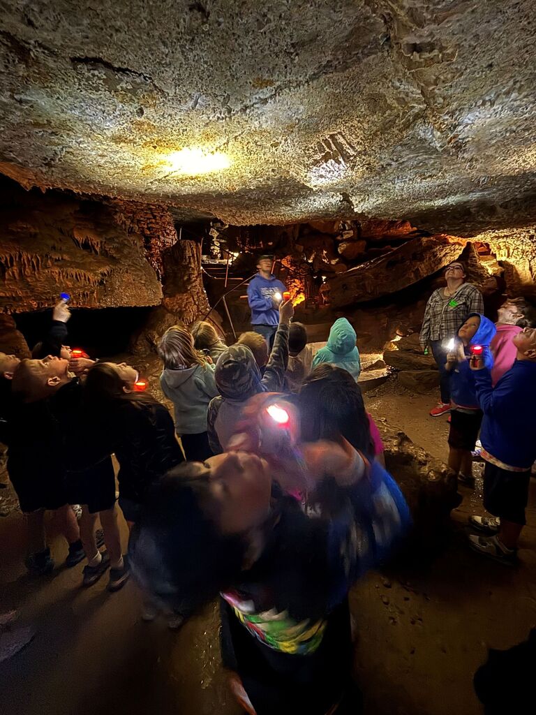 students explore eagle cave