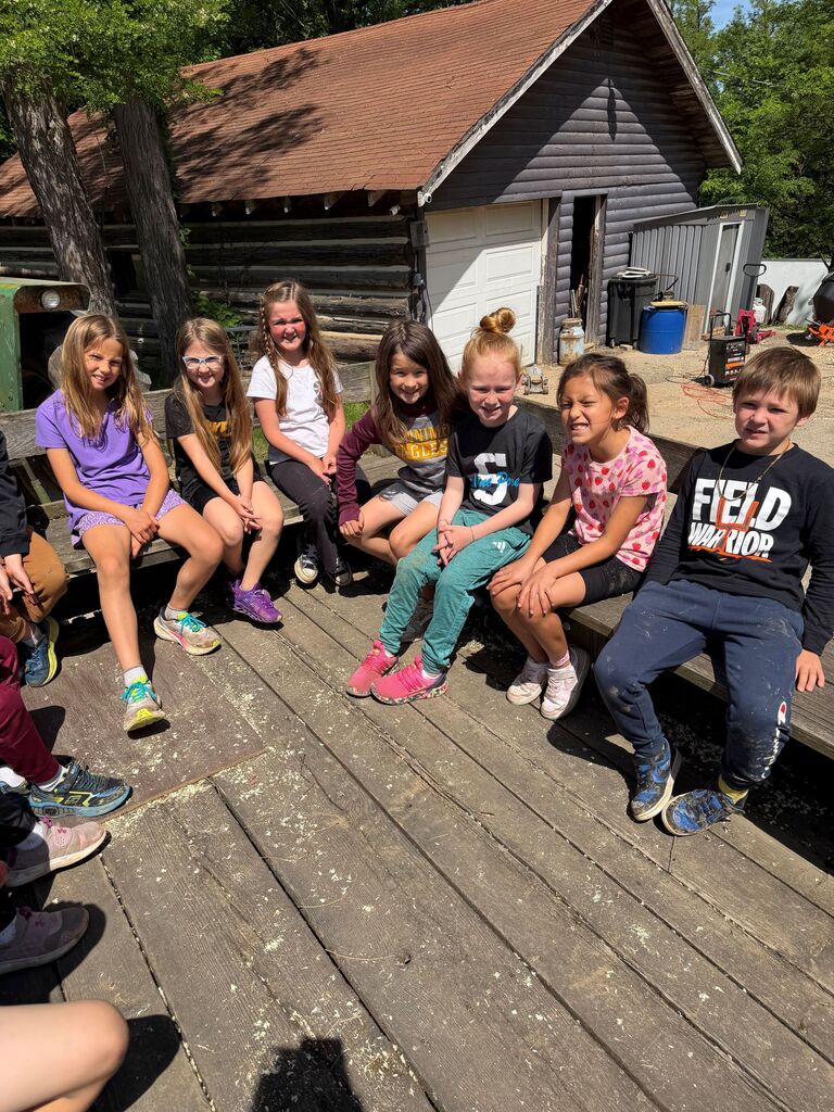 students take a wagon ride at Eagle Cave