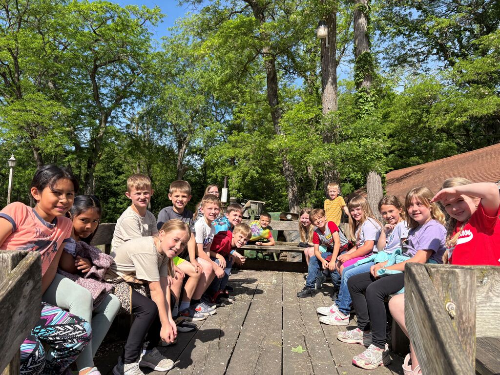 students take a wagon ride at Eagle Cave