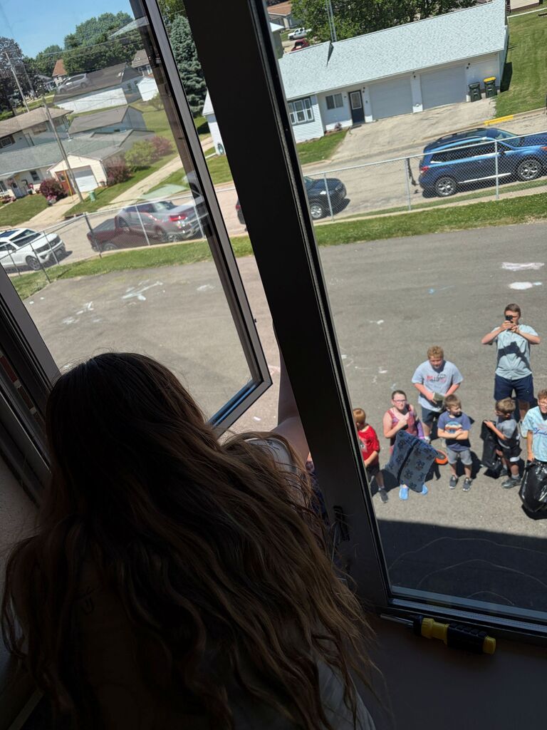 Student drops their contraption from 2nd floor of building as kids watch below