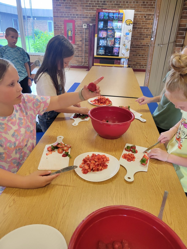 students cutting fruit