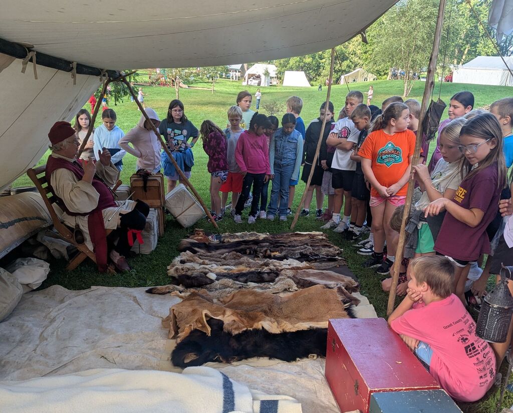students look at different pelts