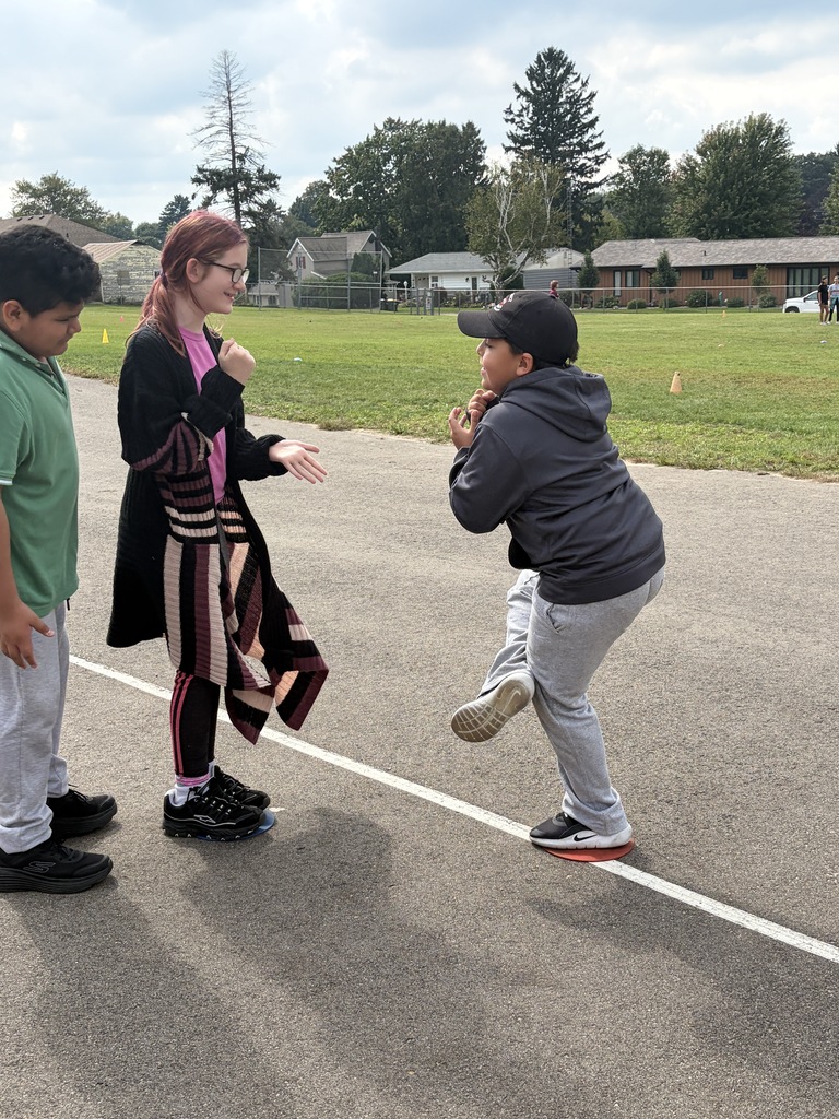 students play rock paper scissors