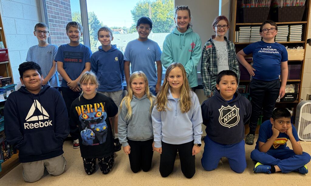 students that are wearing blue take a picture