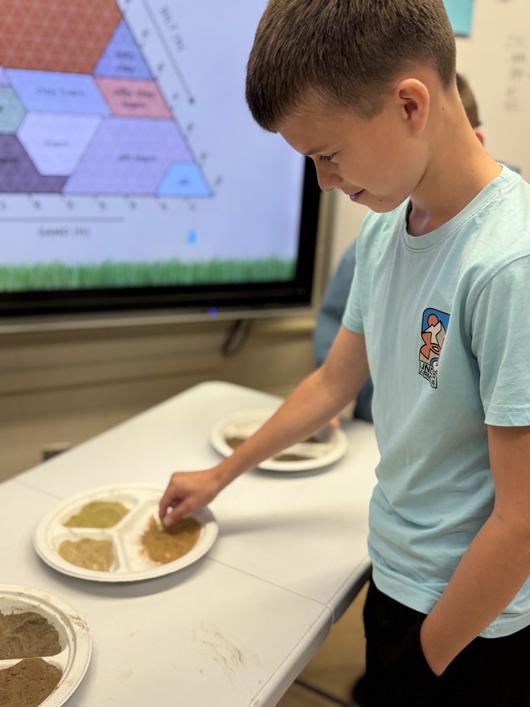 a student feels the different soil types