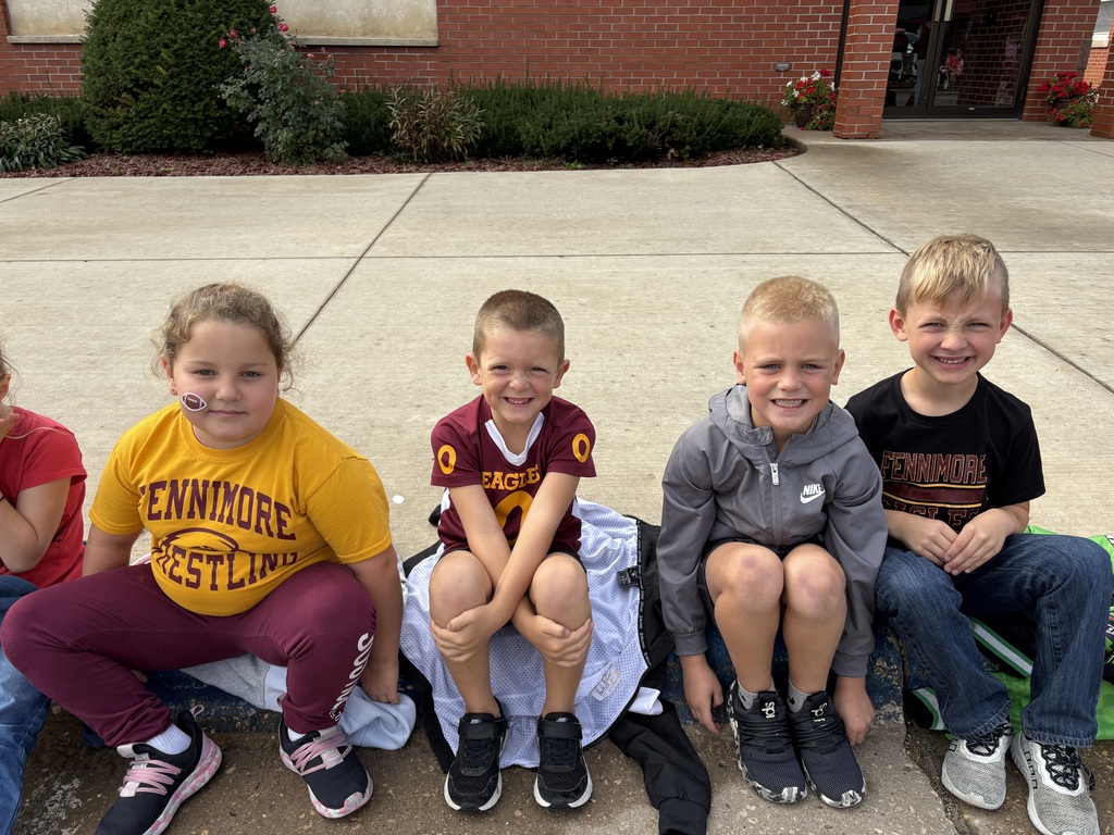 students sit and watch the parade