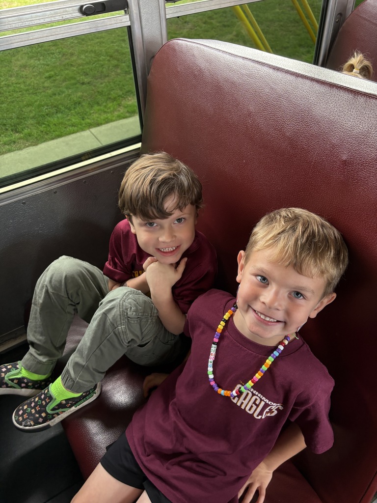 students ride the bus in the HOCO parade