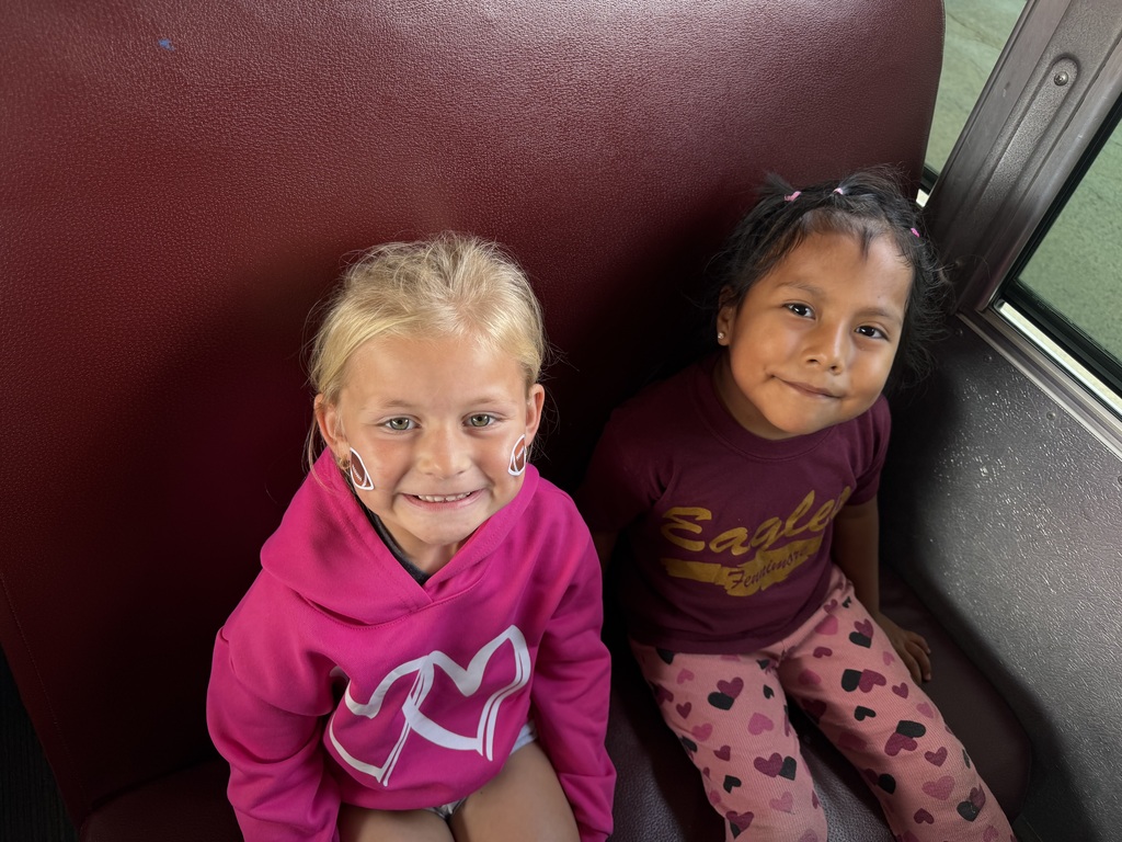 students ride the bus in the HOCO parade