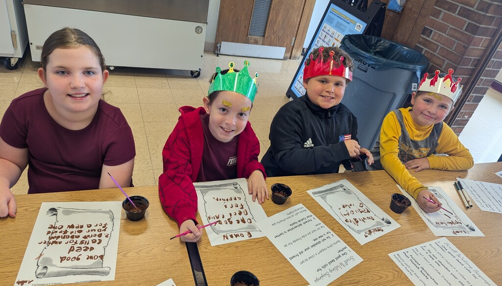 students write on scrolls