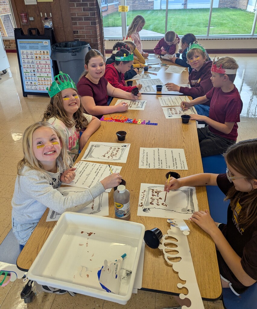 students write on scroll paper