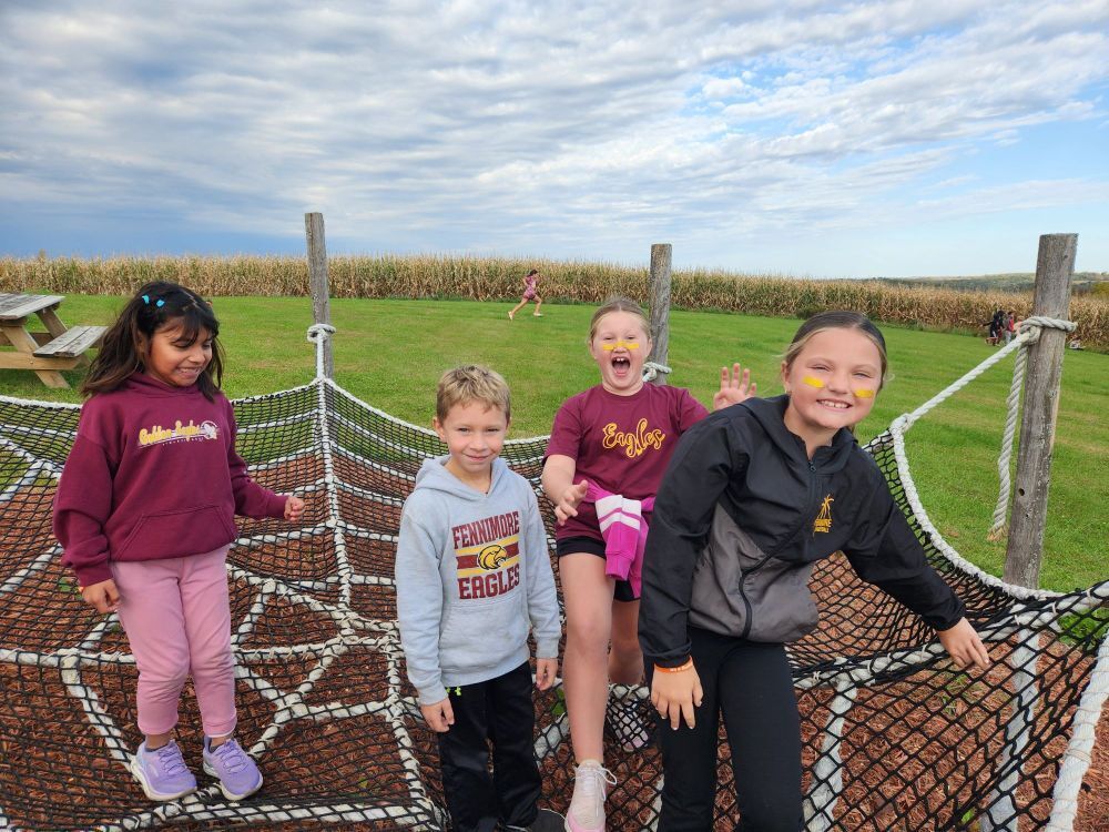 students play at the apple orchard