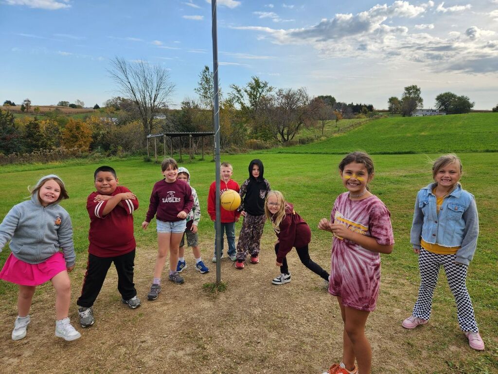 students play ball at the apple orchard