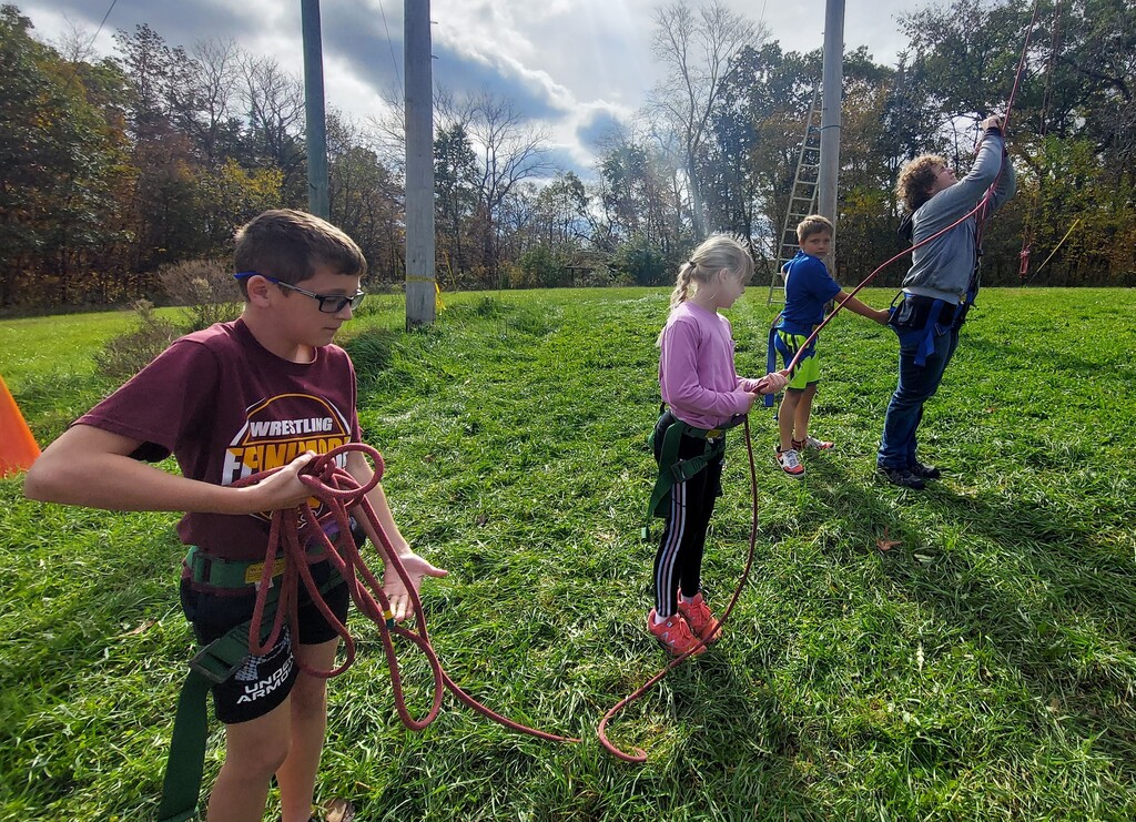 students work together at Bethel Horizons by holding on to the ropes