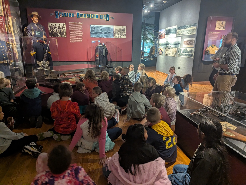 students visit exhibits at the museum