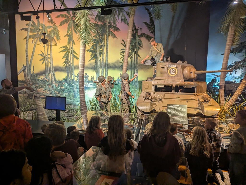 students visit exhibits at the museum