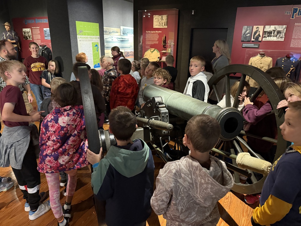 students visit exhibits at the museum