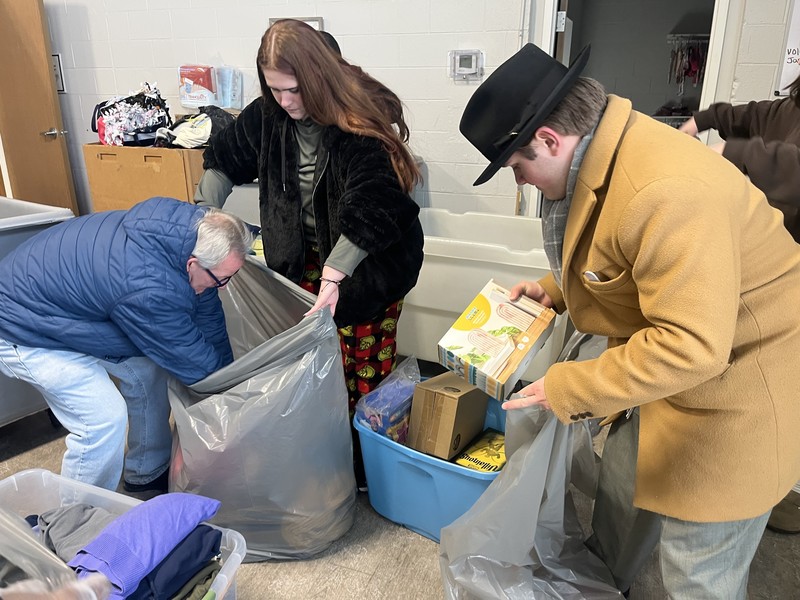 FHS student unloading a van full of donations to Carriage Town Ministries in Flint, MI.