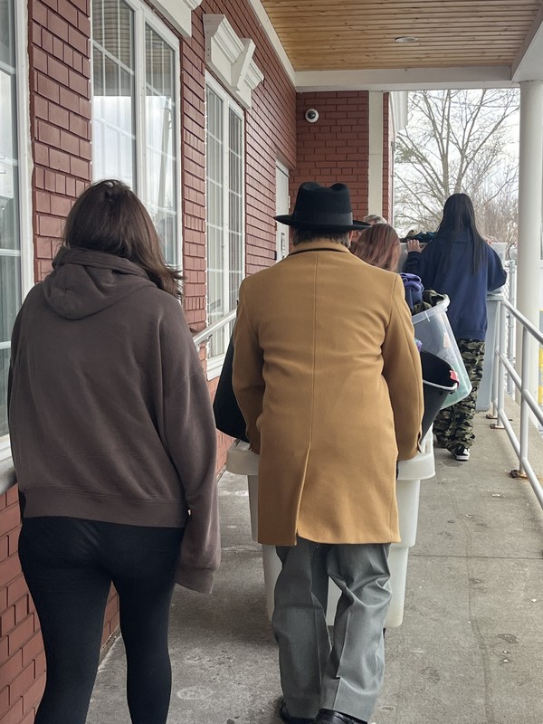 FHS student unloading a van full of donations to Carriage Town Ministries in Flint, MI.