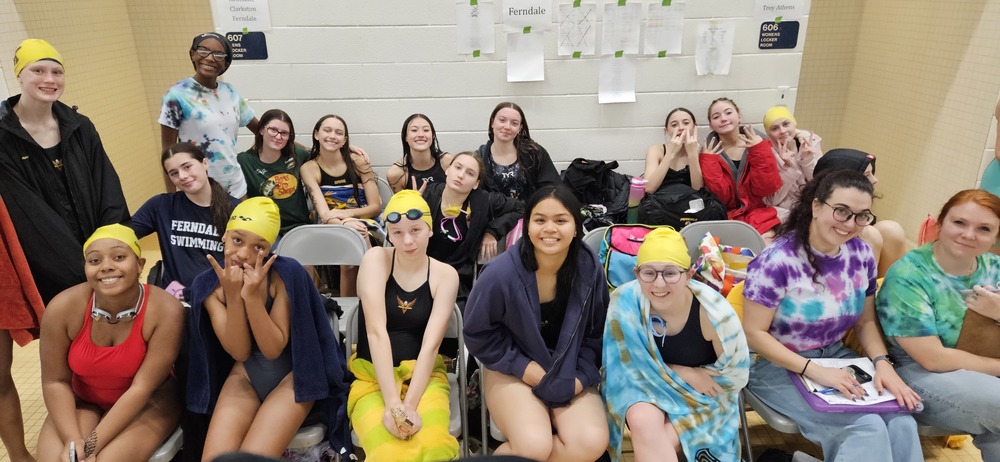 swim team poses at states