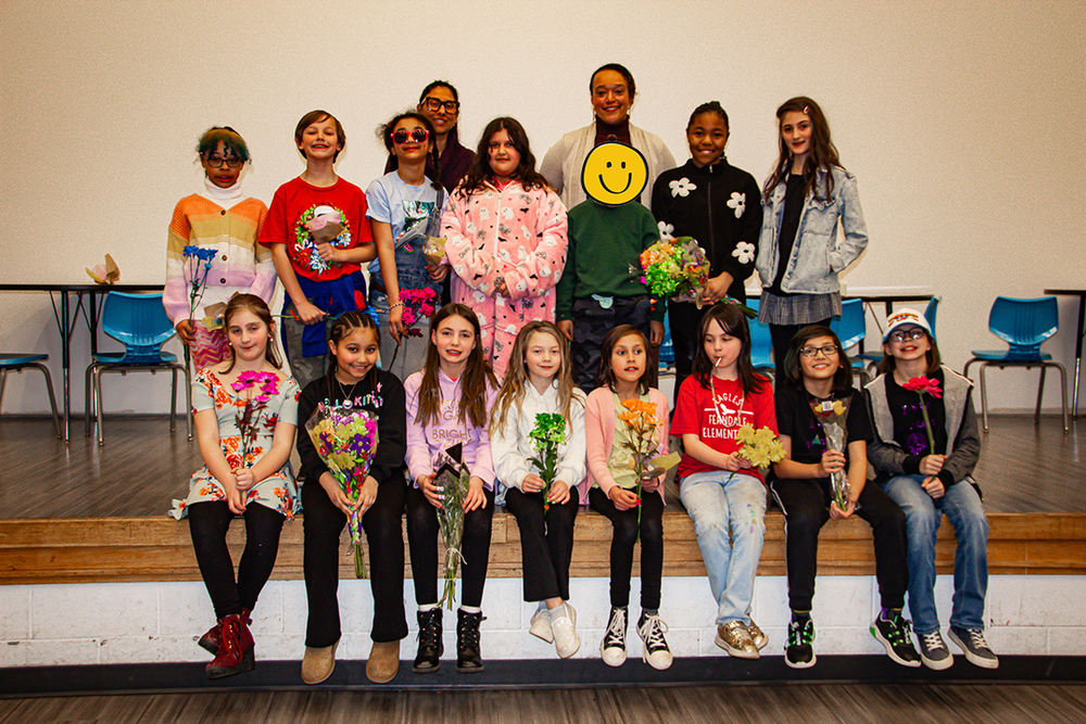 students pose after musical performance