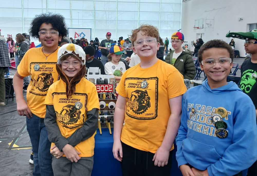 Screaming eagles pose with their robot