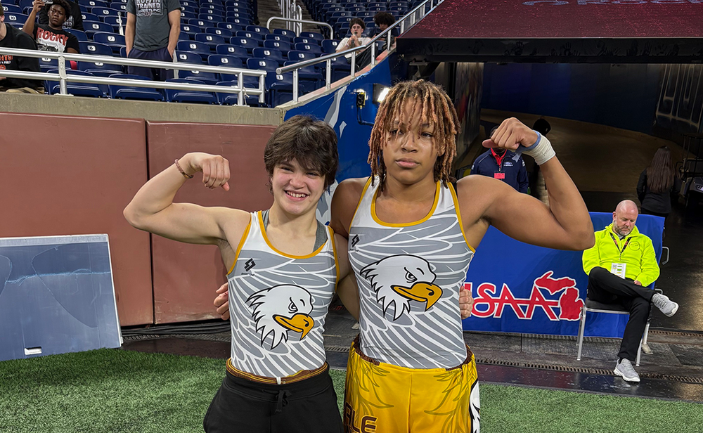 Two All-State FHS Girls Wrestling champions pose at Ford Field