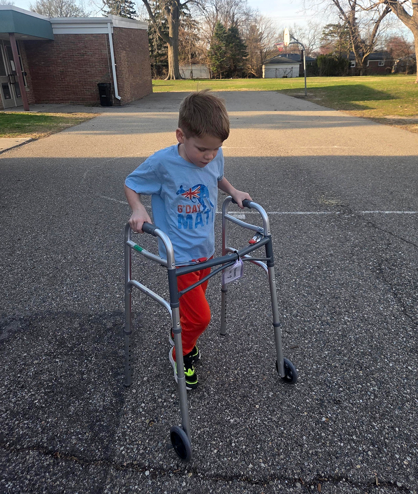 students in Cub Scouts at FUEL practice  using assistive devices to learn empathy for persons living with disabilities