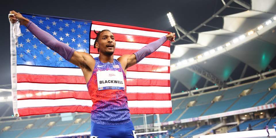 jaydin blackwell stands with flag