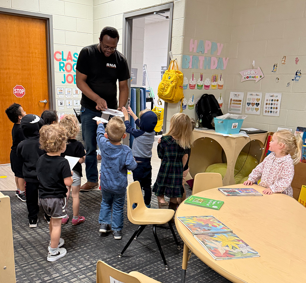 children give cards to their custodian