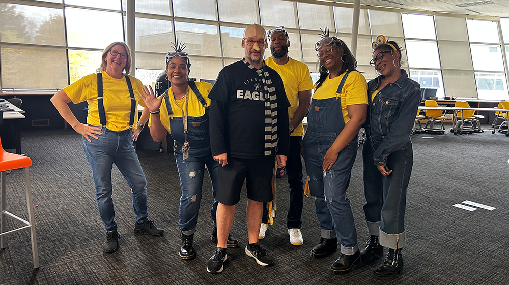 admins dressed up as Gru and minions for halloween