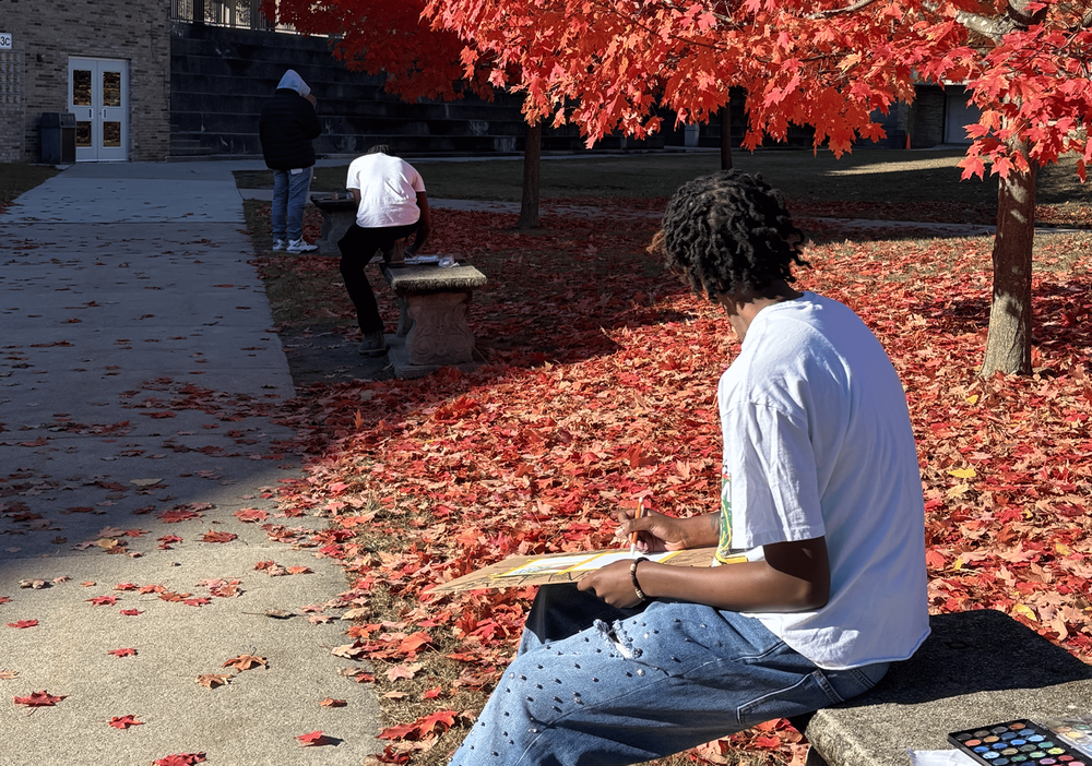 Students use watercolors to paint colorful fall leaves in the Ferndale High  School courtyard