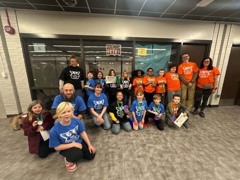 lego robotics teams pose at competition