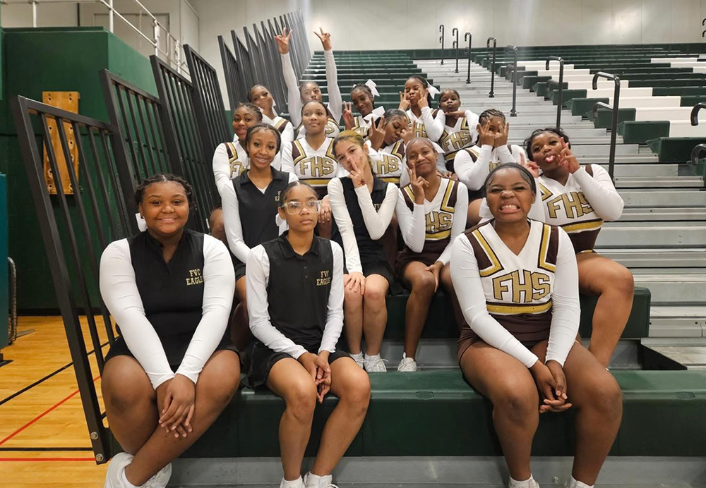 JV Cheer poses in the gym