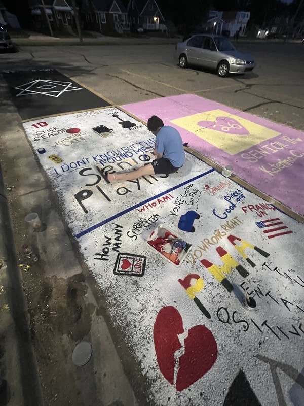 seniors paint parking spaces