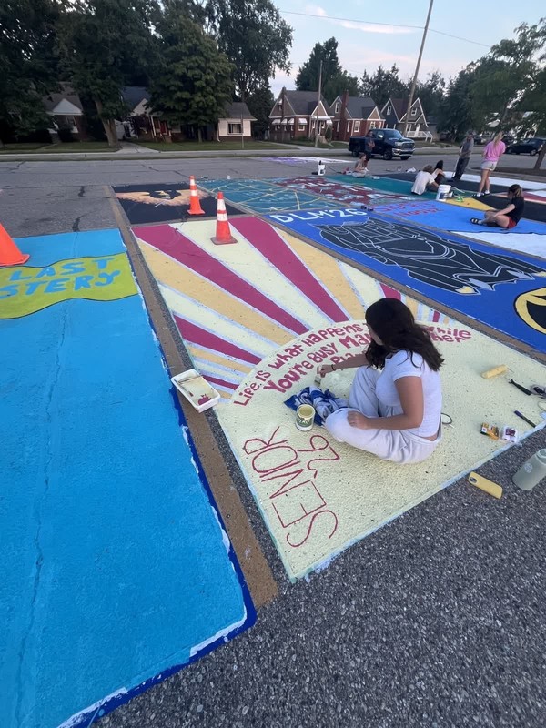 seniors paint parking spaces
