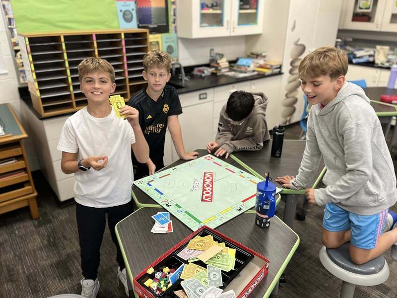 students play monopoly