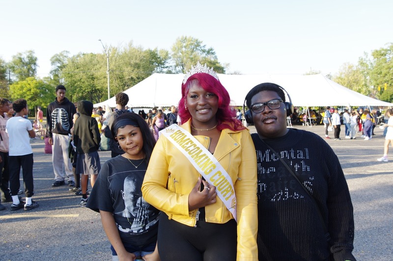 homecoming queen poses with family members