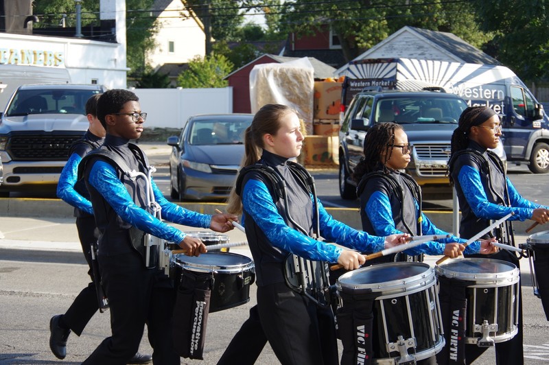 community marches in homecoming parade