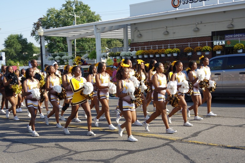 community marches in homecoming parade