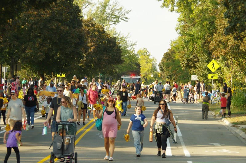 community marches in homecoming parade